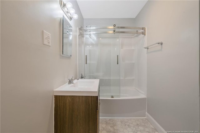 bathroom featuring tile patterned flooring, shower / tub combination, and vanity