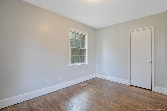 spare room featuring hardwood / wood-style floors