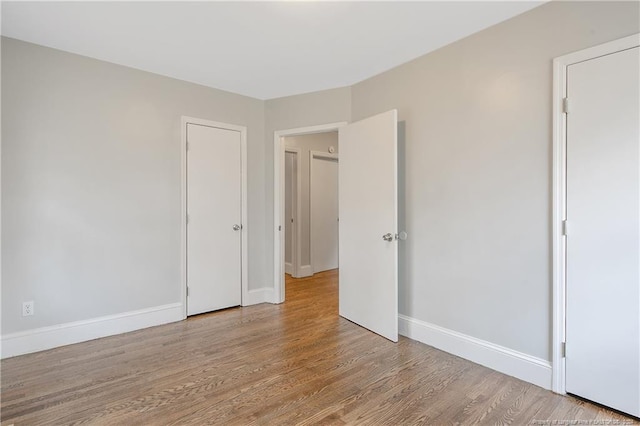 unfurnished bedroom with light hardwood / wood-style floors