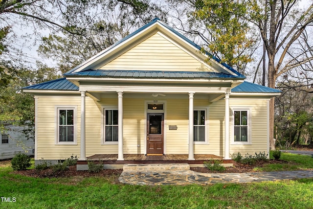 view of front of house featuring covered porch and metal roof