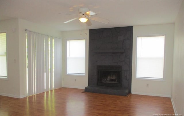 1014 Brookhollow Dr Unit 4, Fayetteville, NC 28314 - unfurnished living room with wood finished floors, a ceiling fan, and healthy amount of natural light