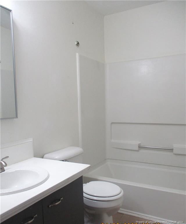 full bathroom featuring vanity, tub / shower combination, and toilet