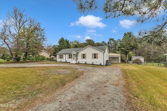 view of front facade with a garage, an outdoor structure, and a front lawn