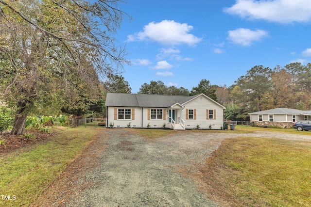 ranch-style house with a front yard