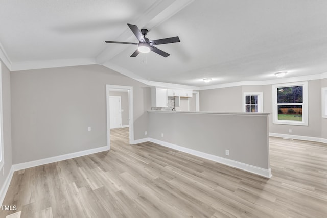 unfurnished living room featuring crown molding, lofted ceiling, ceiling fan, and light hardwood / wood-style flooring