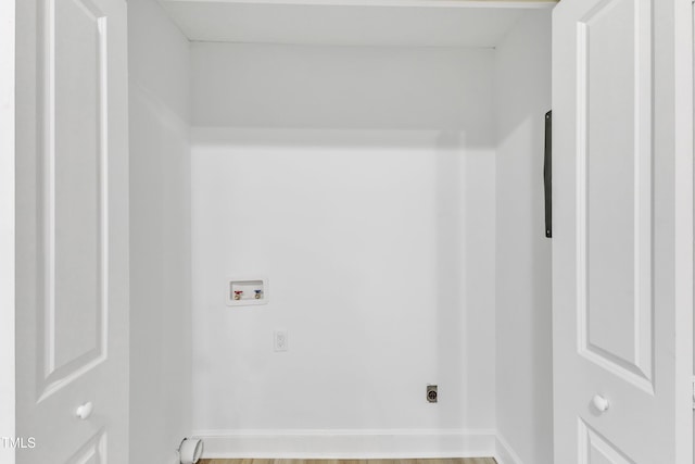 washroom with washer hookup, wood-type flooring, and electric dryer hookup