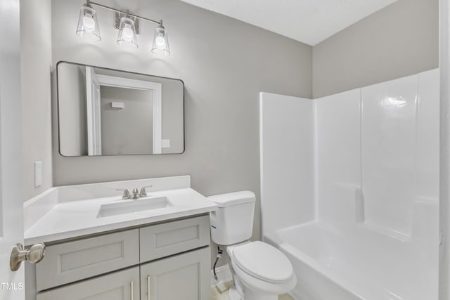 full bathroom featuring shower / bath combination, vanity, and toilet