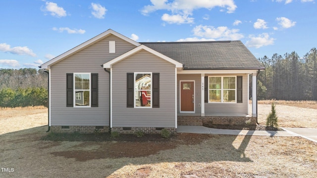 bungalow-style home featuring crawl space, entry steps, and a shingled roof