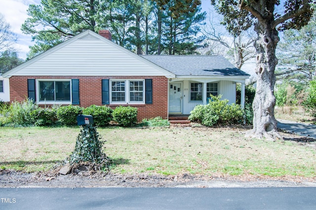 229 Short St, Wendell, NC 27591 - ranch-style home with a chimney, brick siding, and a front yard