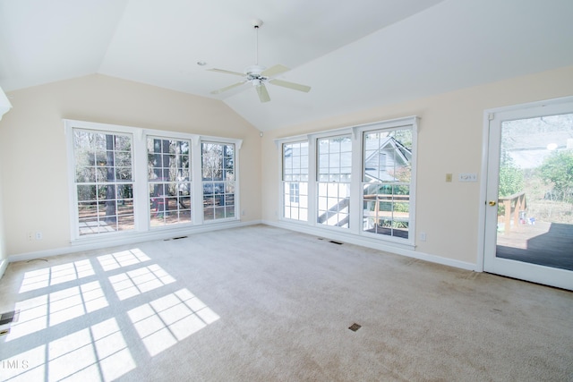 interior space with lofted ceiling, visible vents, baseboards, and ceiling fan