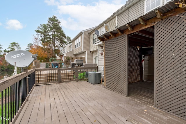 wooden terrace featuring central air condition unit