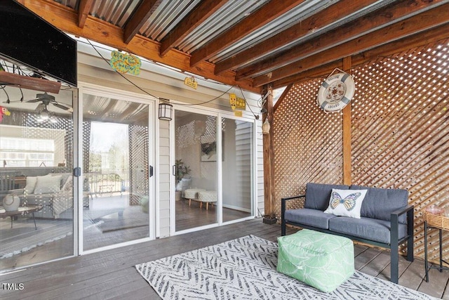 wooden deck featuring outdoor lounge area