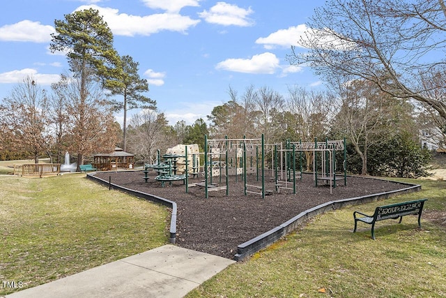 community jungle gym featuring a lawn