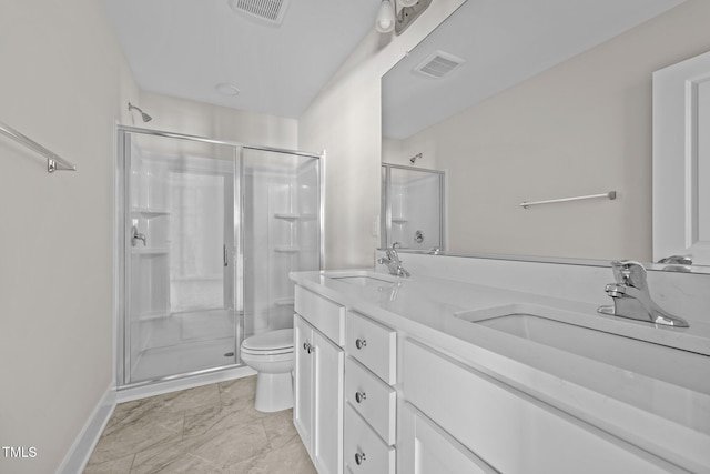 bathroom with vanity, toilet, and an enclosed shower