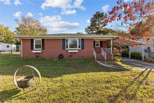 view of front of home featuring a front lawn and a carport