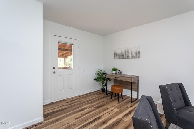 home office featuring hardwood / wood-style floors