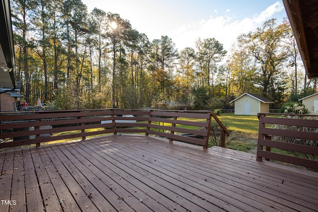 wooden deck featuring a shed