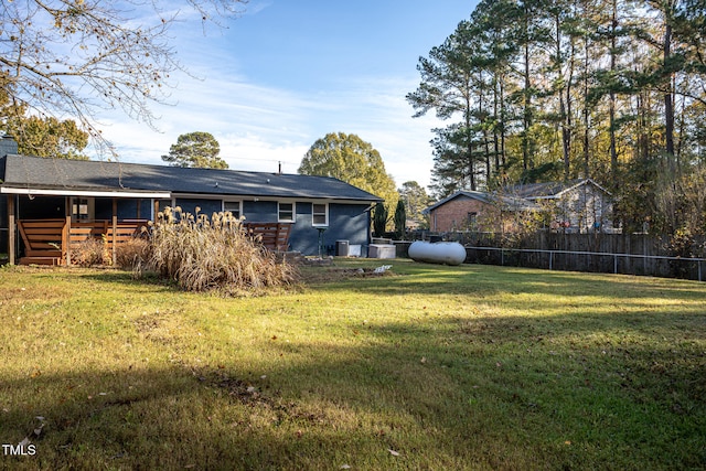 view of yard with a wooden deck