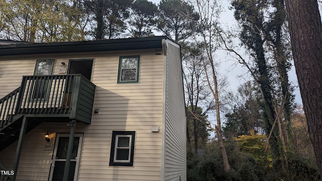 rear view of property with a balcony