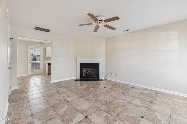 unfurnished living room featuring ceiling fan