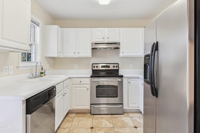 kitchen with white cabinets, appliances with stainless steel finishes, light tile patterned floors, and sink