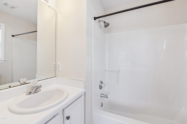 bathroom featuring vanity and bathing tub / shower combination