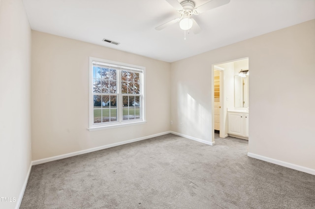 carpeted empty room with ceiling fan