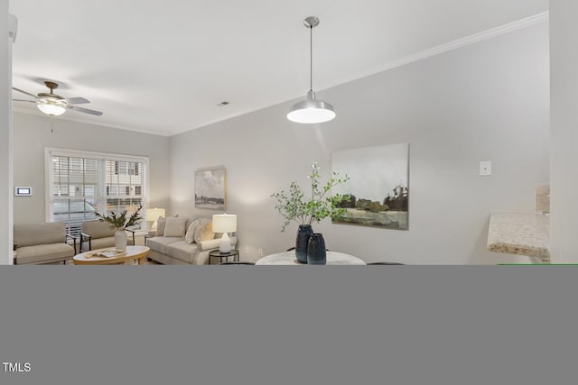 living room featuring crown molding and ceiling fan