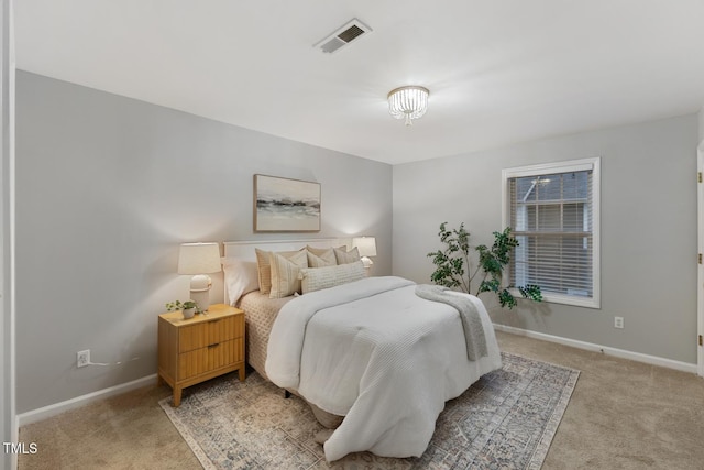 bedroom featuring light carpet