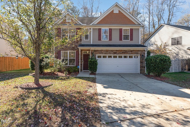 front of property featuring a front lawn and a garage