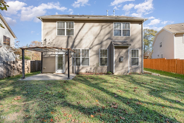 back of property featuring a yard, a pergola, and a patio