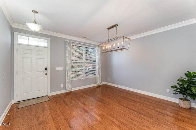 foyer featuring crown molding and wood-type flooring