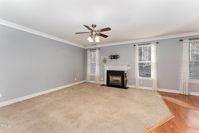 unfurnished living room featuring ceiling fan, crown molding, and light hardwood / wood-style floors