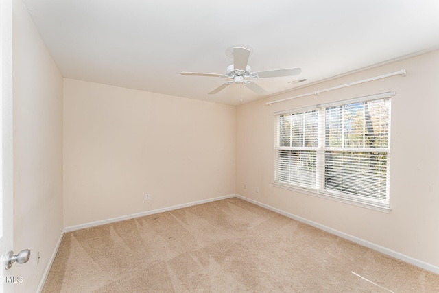 carpeted empty room with ceiling fan