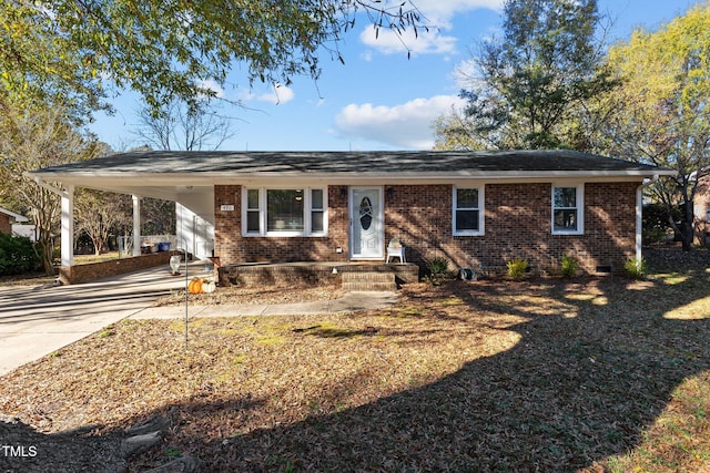 ranch-style house featuring a carport