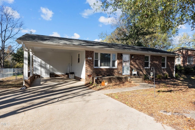 ranch-style home featuring a carport