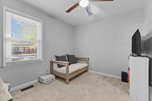 bedroom featuring ceiling fan and light colored carpet