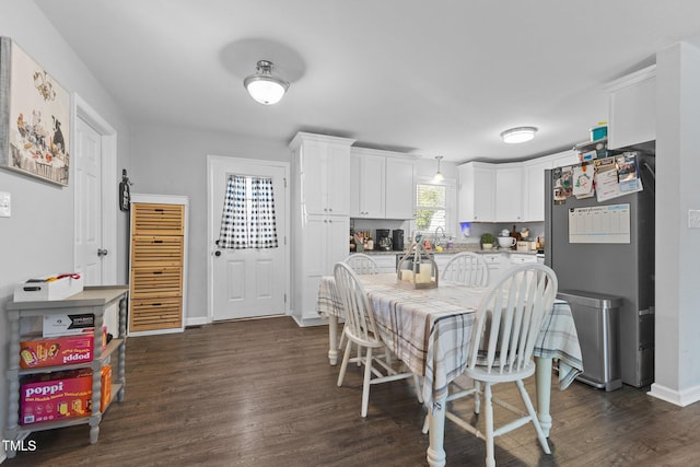 dining room with dark hardwood / wood-style floors