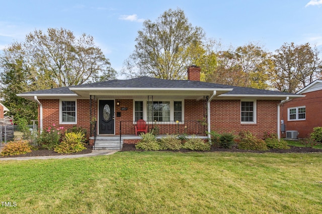 view of front of property featuring a porch, cooling unit, and a front yard