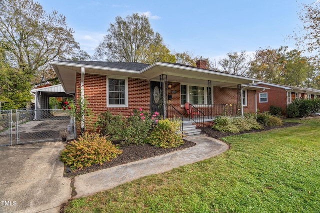 single story home with a porch, a front yard, and a carport