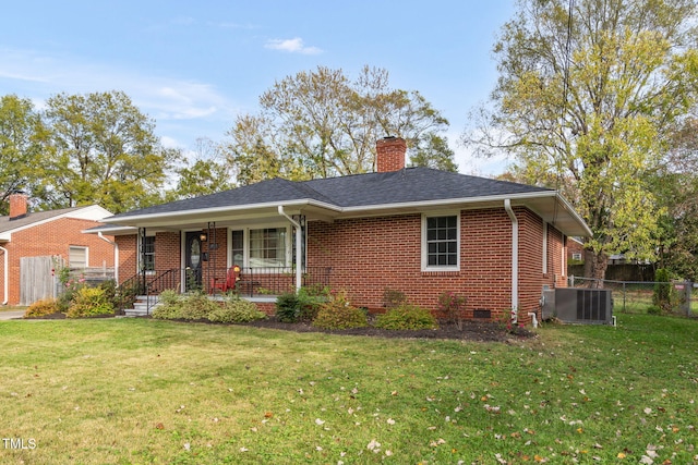 view of front of property with central AC unit, a porch, and a front yard