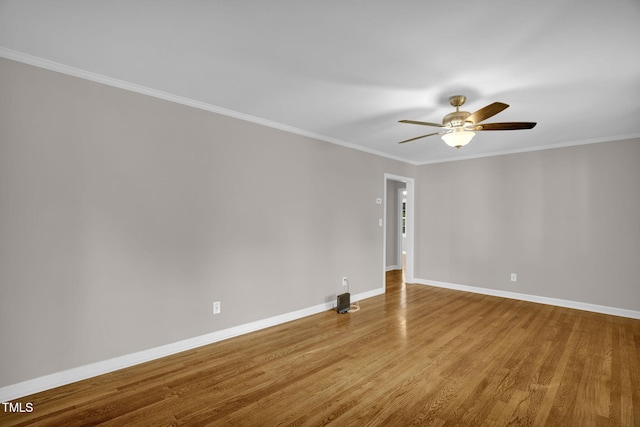 spare room featuring ceiling fan, crown molding, and light hardwood / wood-style flooring