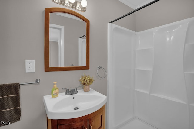 bathroom featuring a shower and sink