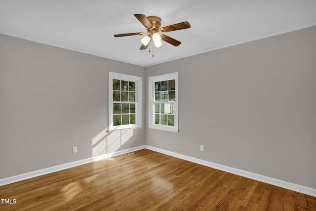 spare room featuring hardwood / wood-style flooring and ceiling fan