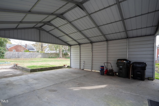 garage featuring a lawn