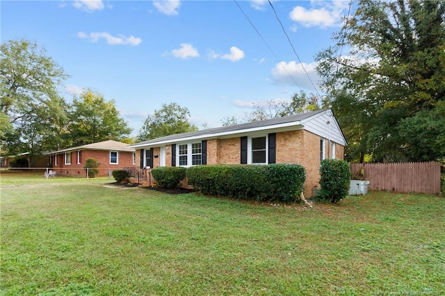 ranch-style home with a front yard