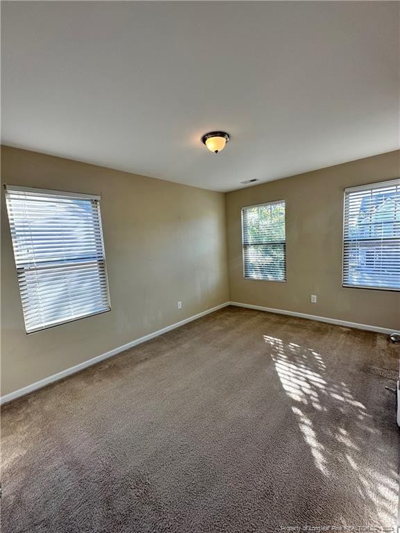 empty room featuring carpet floors