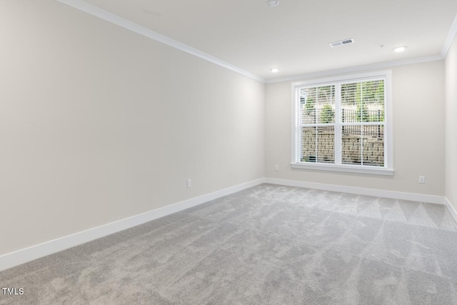 carpeted spare room with ornamental molding