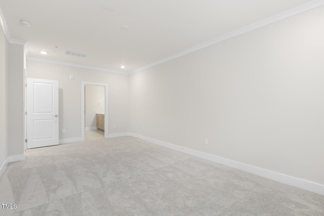 carpeted empty room featuring ornamental molding