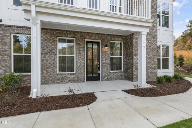 property entrance with a balcony